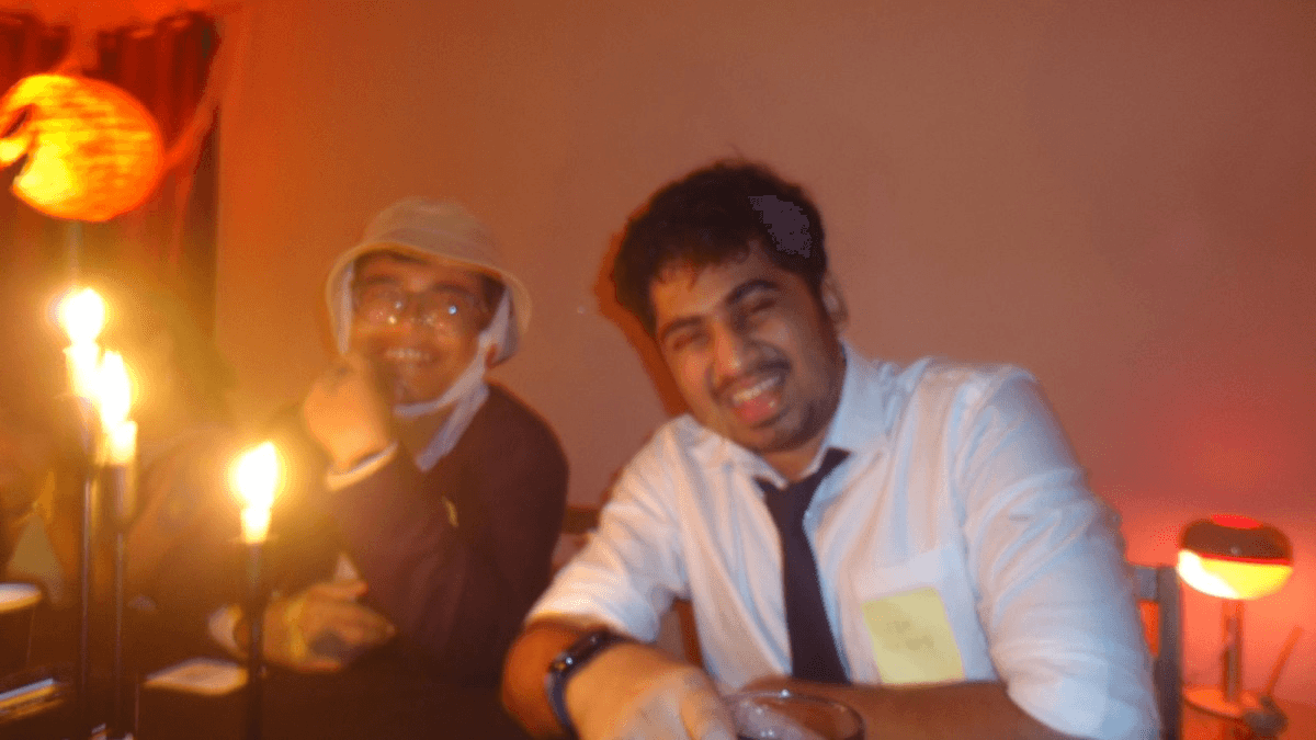 Two friends at a social gathering